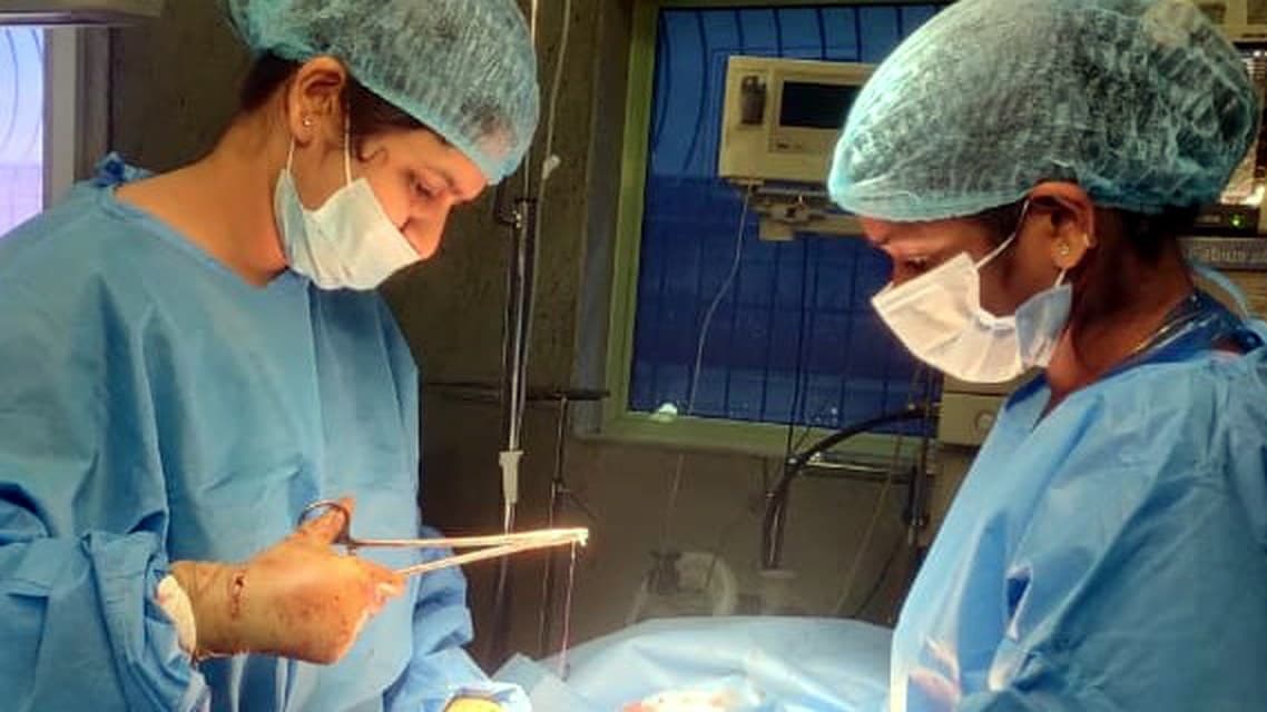 Dr. Priyal Agarwal operating in theatre with a colleague